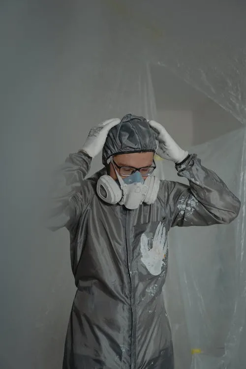 mold remediation colorado springs — certified technician in PPE removing black mold
